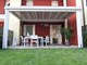 Porticati in legno in appoggio all'abitazione